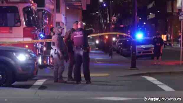 2 men shot inside Beltine condo building, suspect in custody