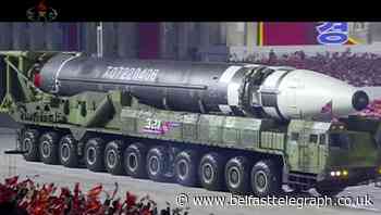 North Korea unveils new weapons at military parade