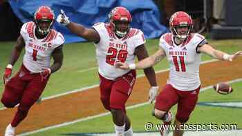 WATCH: NC State's 320 pound defensive tackle rumbles for 18-yard pick-six against Virginia