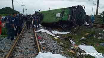 Bus-train collision in Thailand leaves 20 dead