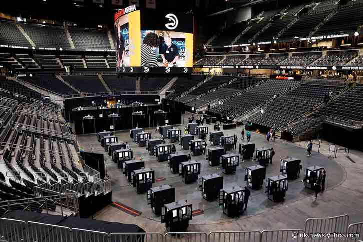 After months without fans, Atlanta arena springs to life with early voters