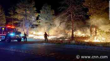 Firefighters battle wildfire on US base