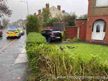 Man arrested after crashing car into garden in Farnworth