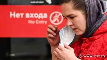 With COVID-19 cases soaring, Russia shuns lockdown but doubles down on enforcement