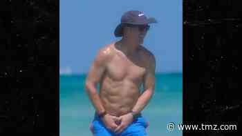 Peyton Manning Has a 6-Pack?! QB Flexes Impressive Physique On Beach Vacay