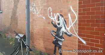 Banksy-style artwork defaced after cover placed over it