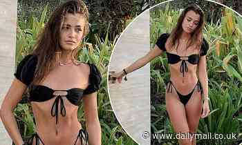 Natalya Wright shows off her lithe physique in a black bikini