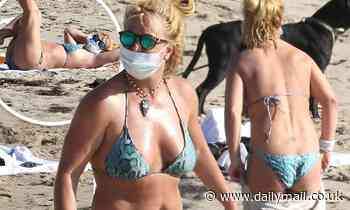 Britney Spears shows off her bikini body on the beach in Malibu... after winning small legal victory