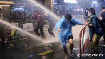 Thai police fire water cannons on defiant anti-government protesters