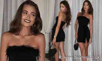 Natalya Wright looks incredible as she showcases her svelte figure in TINY black feathered dress