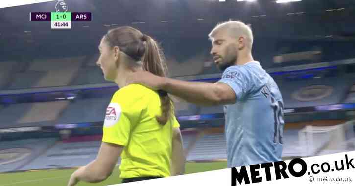 Sergio Aguero grabs assistant referee Sian Massey during Man City vs Arsenal