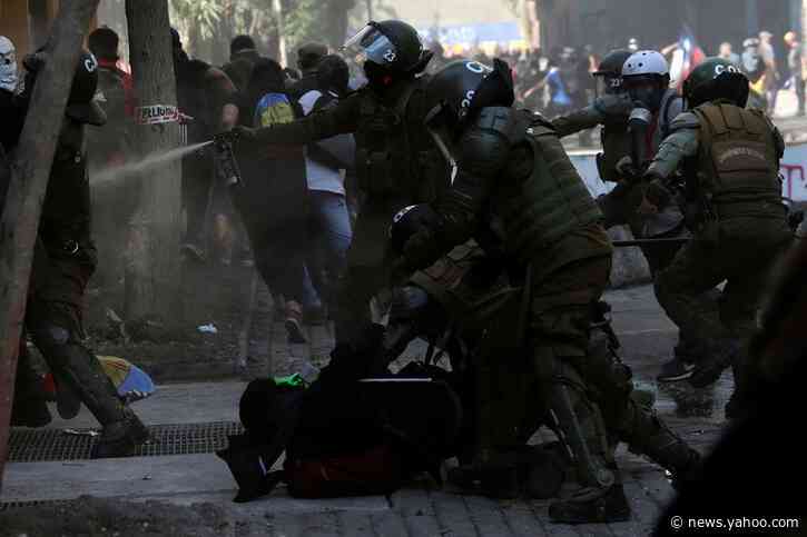 Chile anniversary rallies turn violent as churches burned, police fire tear gas