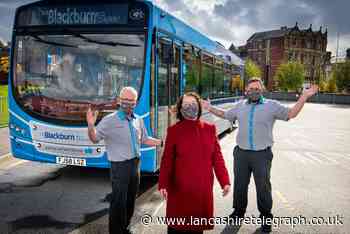 Blackburn MP covers up to remind people of travel mask rules