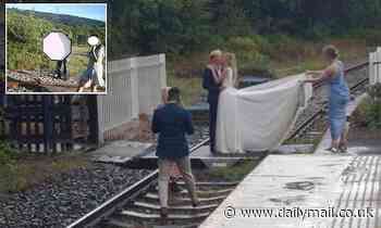 Witless newlyweds pose for photos on RAILWAY TRACK as trespassing soared to a five-year high