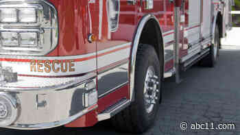 Wake County fire tanker overturns as crews battle house fire