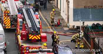 Police called after firefighters' discovery inside burning block of flats