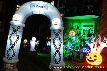 Sutton woman applauded by hundreds for Halloween display