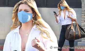Mischa Barton wears plunging white blouse and stiletto boots in LA