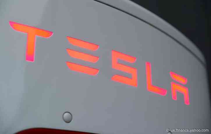 Tesla cracks revenue record and beats estimates, shares take off