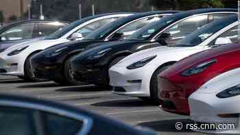 Tesla posts record profit and says it will sell half a million cars this year