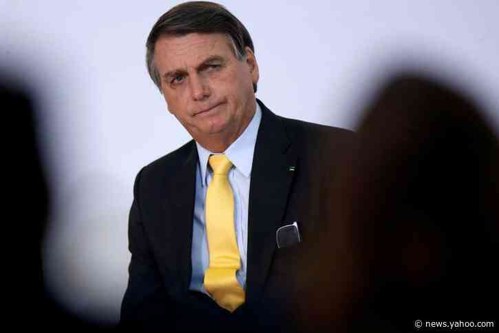 Brazil's Bolsonaro chats with coronavirus-infected health minister wearing no mask
