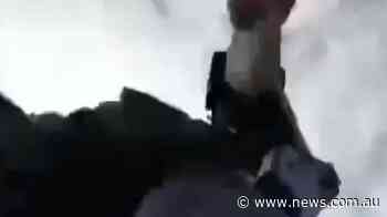 Smashed phone records police at protest