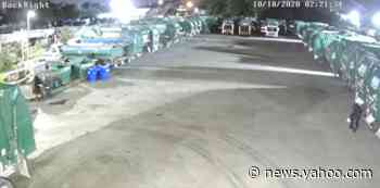 Watch a man in a garbage bag ‘suit’ set fire to garbage trucks at Broward waste center