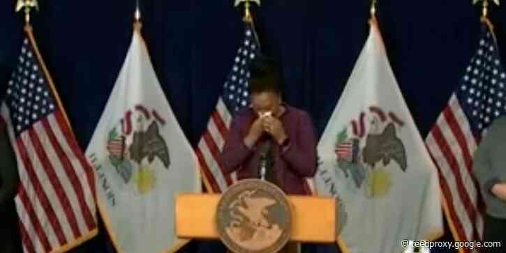 The public health director for Illinois broke down in tears while announcing a new state record for COVID-19 infections