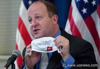 The Latest: Colorado Gov. Jared Polis Self-Quarantines