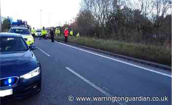 Driver trapped in car after rolling down M6 embankment near Lymm