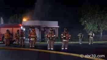 Road closed as firefighters battle building fire in central Fresno