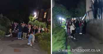 Students ignoring social distancing gathering outside halls