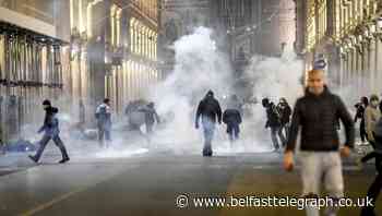 Protests in Italy over new virus crackdown turn violent