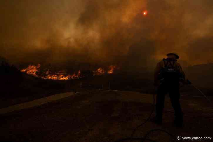 Wind-driven Southern California wildfires prompt mass evacuations, injure 2 firefighters