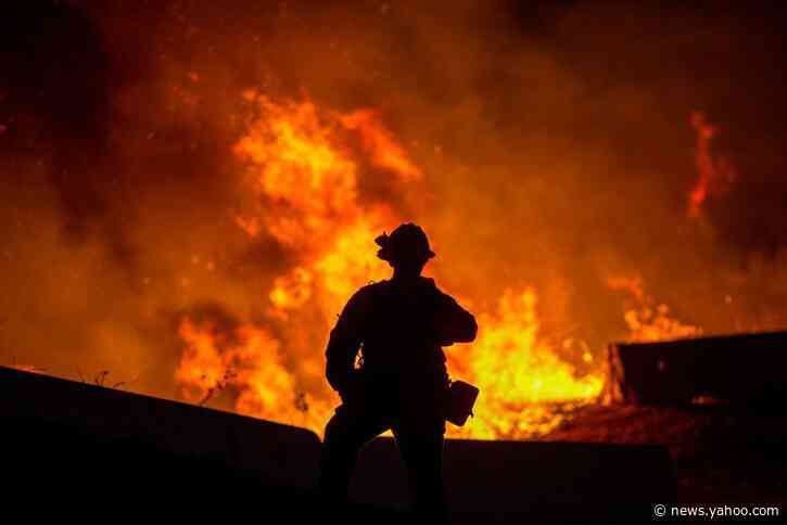 Wind-whipped Southern California wildfires prompt mass evacuations, injure two firefighters