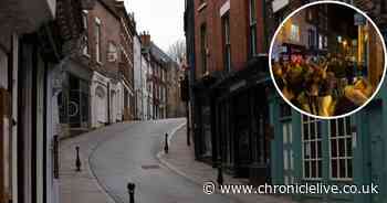 Watch huge crowd flout Covid rules by dancing outside Greggs