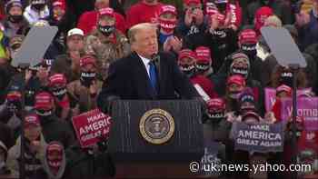 Trump campaigns at rain-soaked Michigan rally