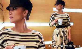 Jennifer Lopez looks utterly elegant as she wears a flowing cream skirt and striped sweater: