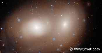 Hubble telescope gets Halloween-y with grinning 'Greater Pumpkin' galaxies     - CNET