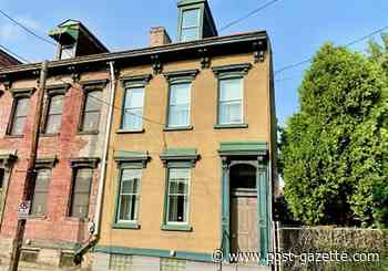 Buying Here: 1880 North Side row house with original woodwork priced under $150,000