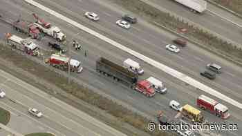 OPP investigating multi-vehicle collision involving school bus on QEW in Oakville