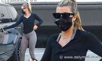 Sofia Richie keeps it casual in black henley and skintight grey leggings as she runs errands in LA