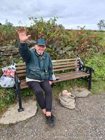 Bolton 'waving man' Tommy donates money to charity