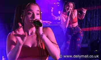 Ella Eyre flashes her abs in a red crop top as she performs at the virtual KISS Haunted House party
