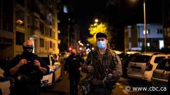 French police release suspect in priest's shooting, widen search