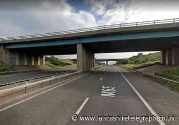 Two members of public save woman from M65 bridge