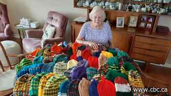 Legally blind senior knits dozens of hats for homeless youth during pandemic