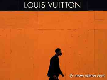 Louis Vuitton is painting boarded up windows its signature orange shade, revealing a dystopian new reality prior to a historic election