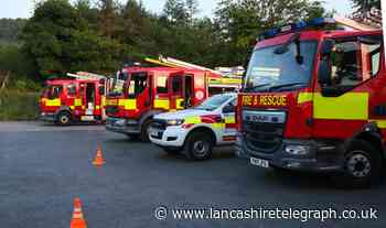 Queen legend, Brian May presents Lancashire firefighters with national award for fundraising