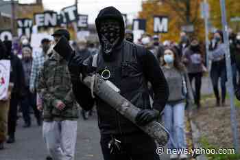 Riot declared in Portland as protesters smash windows